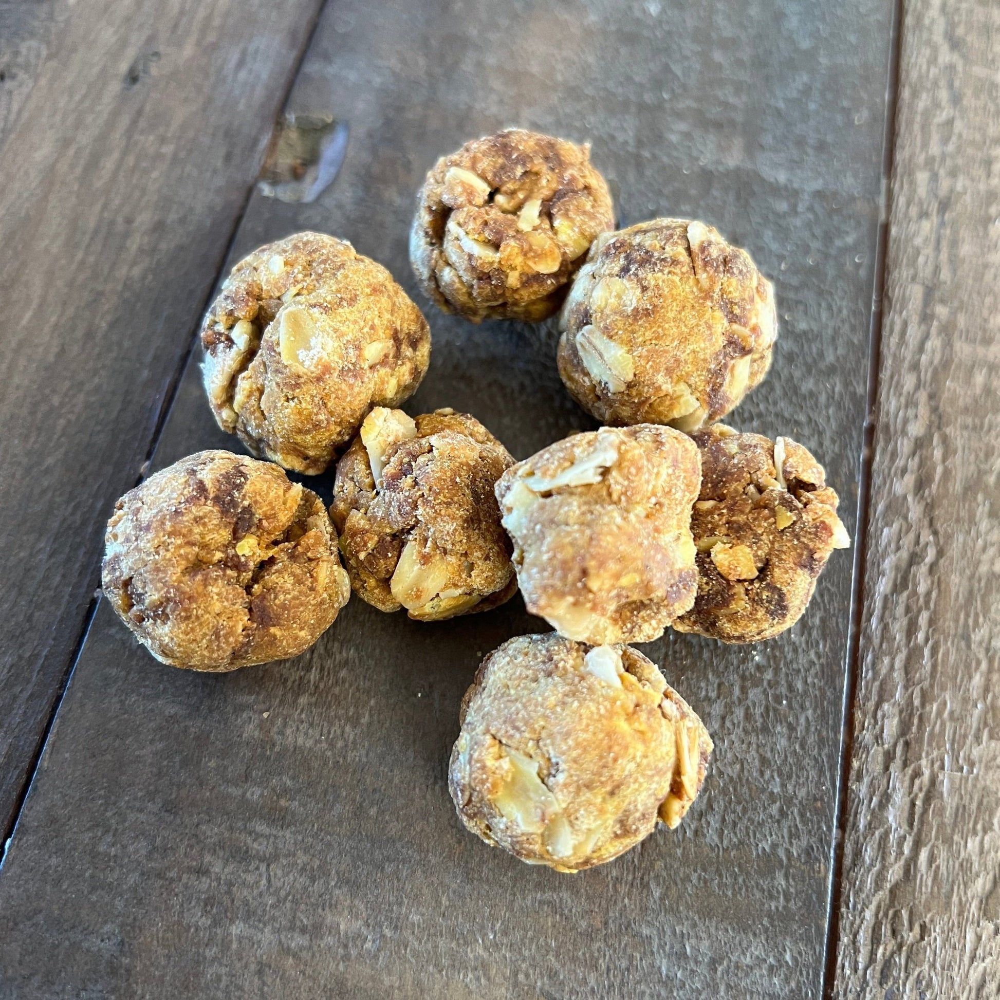 Healthy, low sugar horse treats shown close up on a table. Perfect as a holiday cookie with cinnamon, ginger, oats, carrots, barley and a light touch of molasses. 